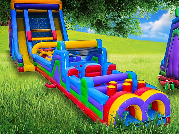 Giant inflatable obstacle course rental on grass in Chicagoland